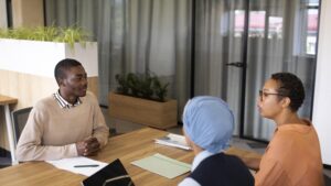 Practicum students having a discussion with their supervisor.