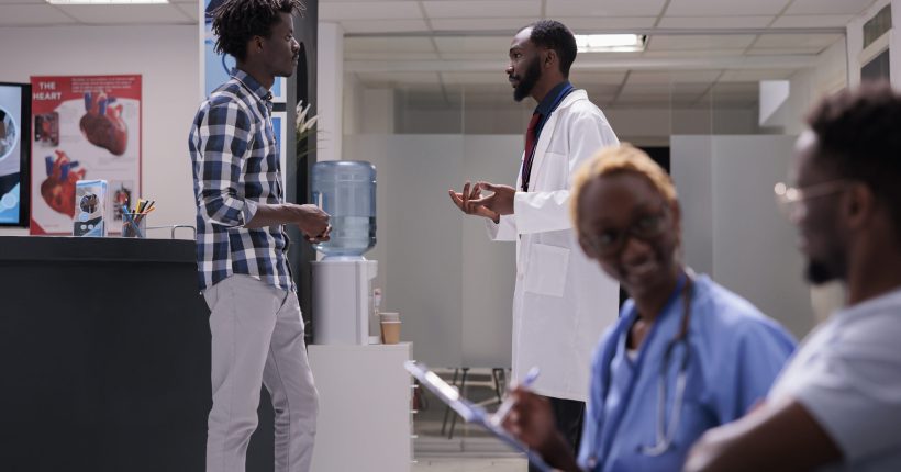 A practicum student and a medic talking